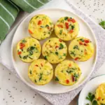Cheesy cottage cheese egg bites in a muffin pan, a high protein breakfast recipe