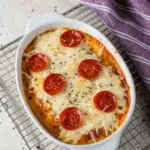 Creamy cottage cheese pizza bowl with melted mozzarella and pasta sauce in a baking dish, a high protein dinner recipe